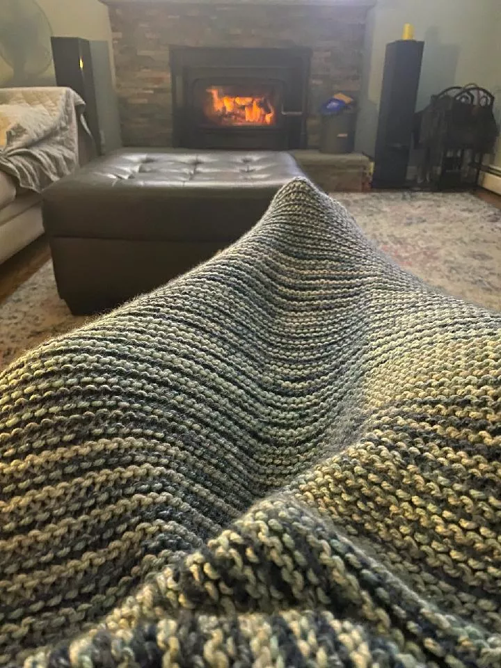 A blue and beige pattern afghan blanket hand-crocheted by Bella Faith Designs.