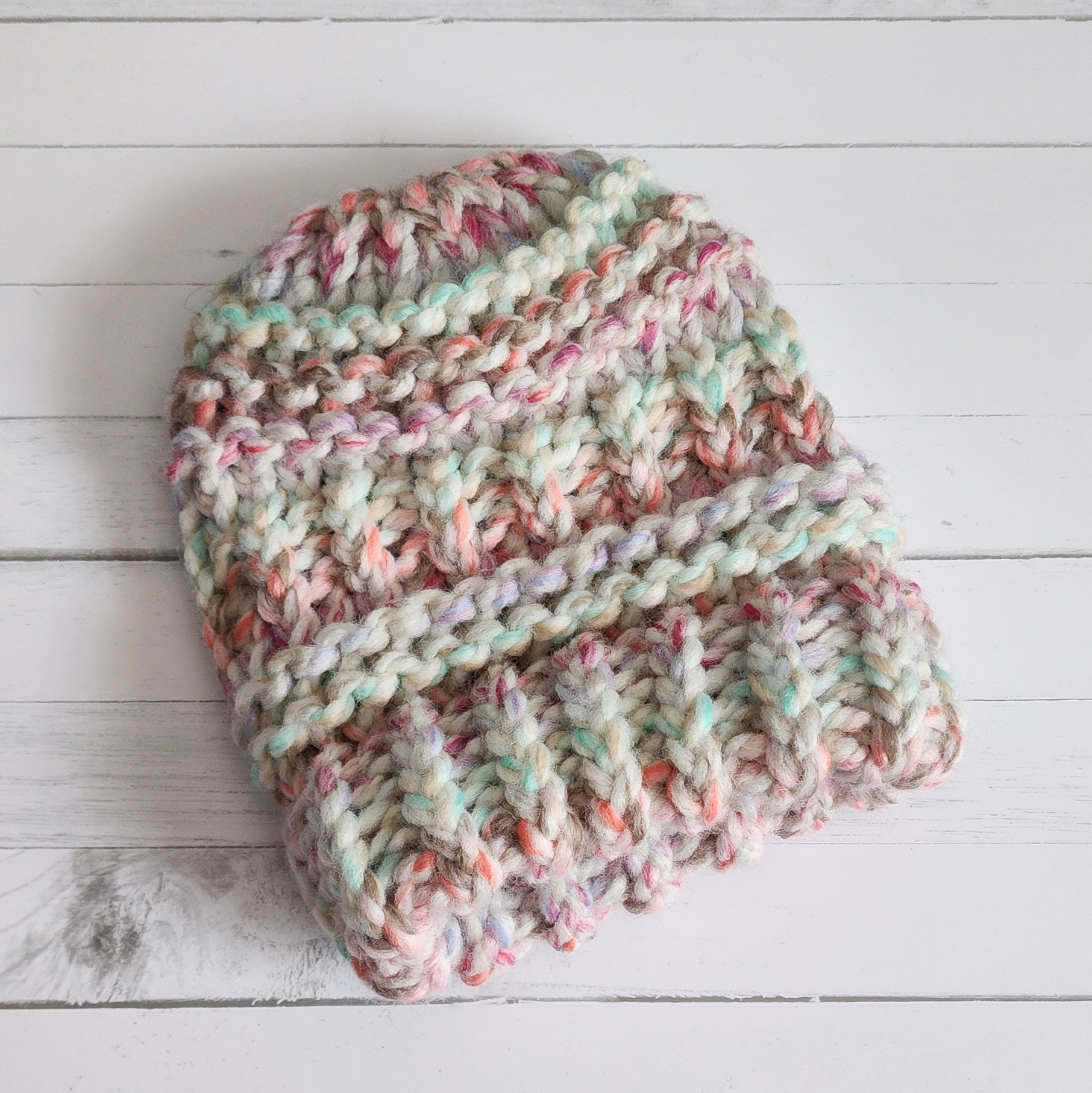 A pastel colored toddler crochet beanie hat made by Bella Faith Designs.